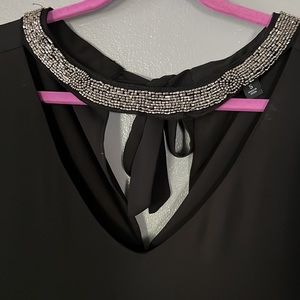 Torrid black flowy top, cut out v neck and tie neck size 5